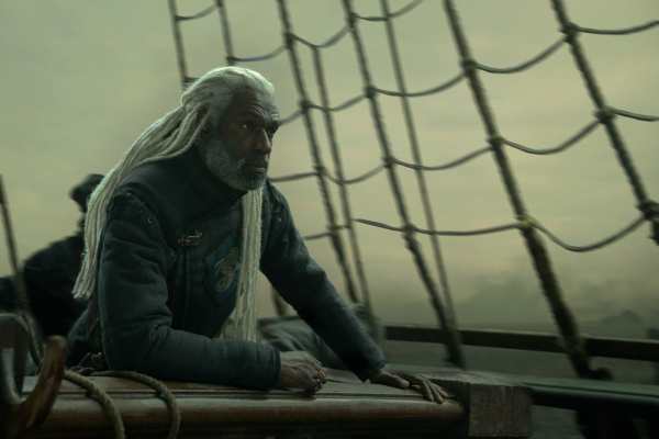 Lord Corlys Velaryon stands on his ship in a still from season three of House of the Dragon.
